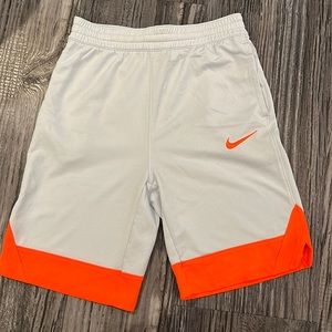 White and orange basketball shorts